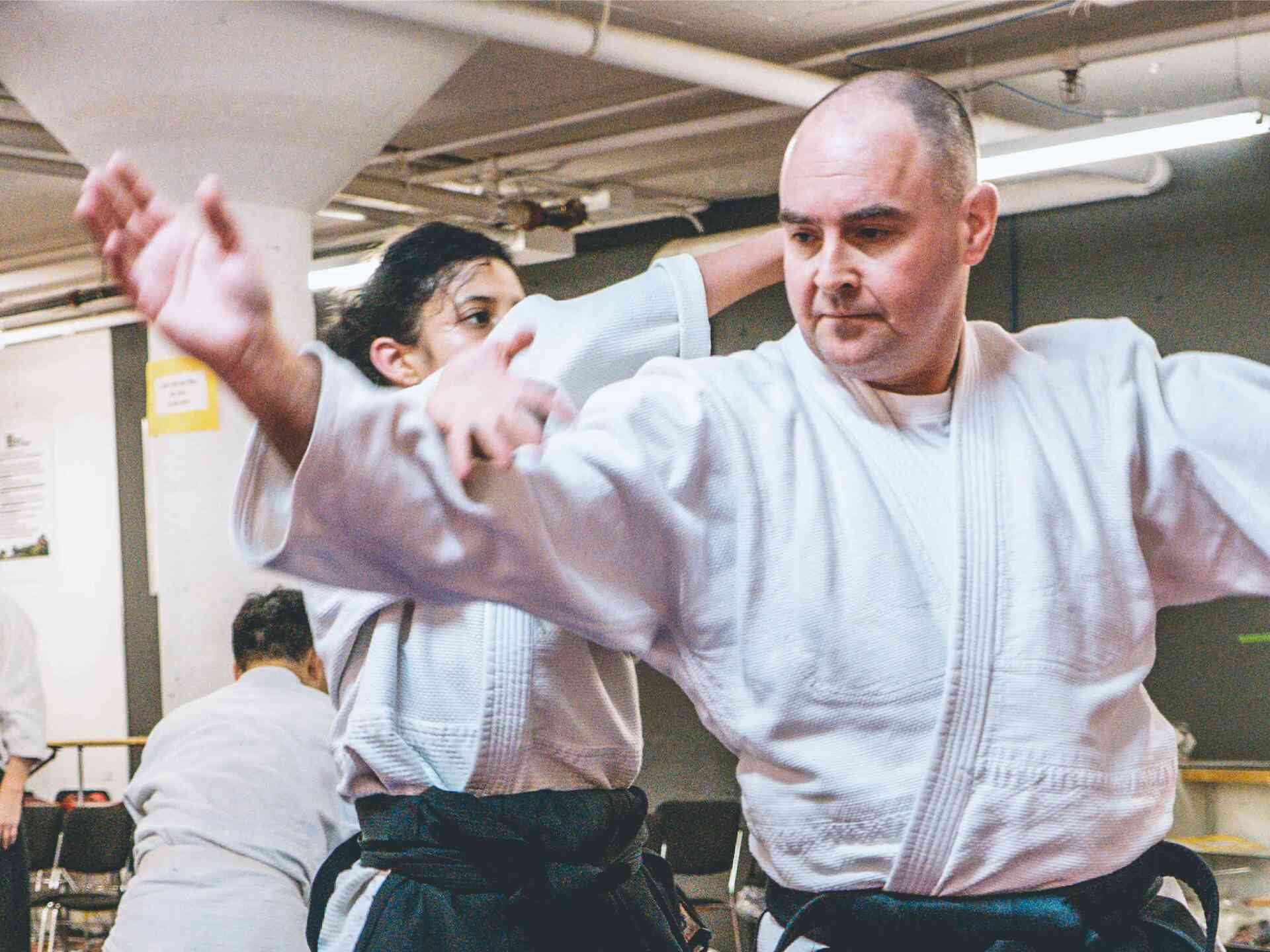 Aikido Federation - man-and-woman-practicing-aikido